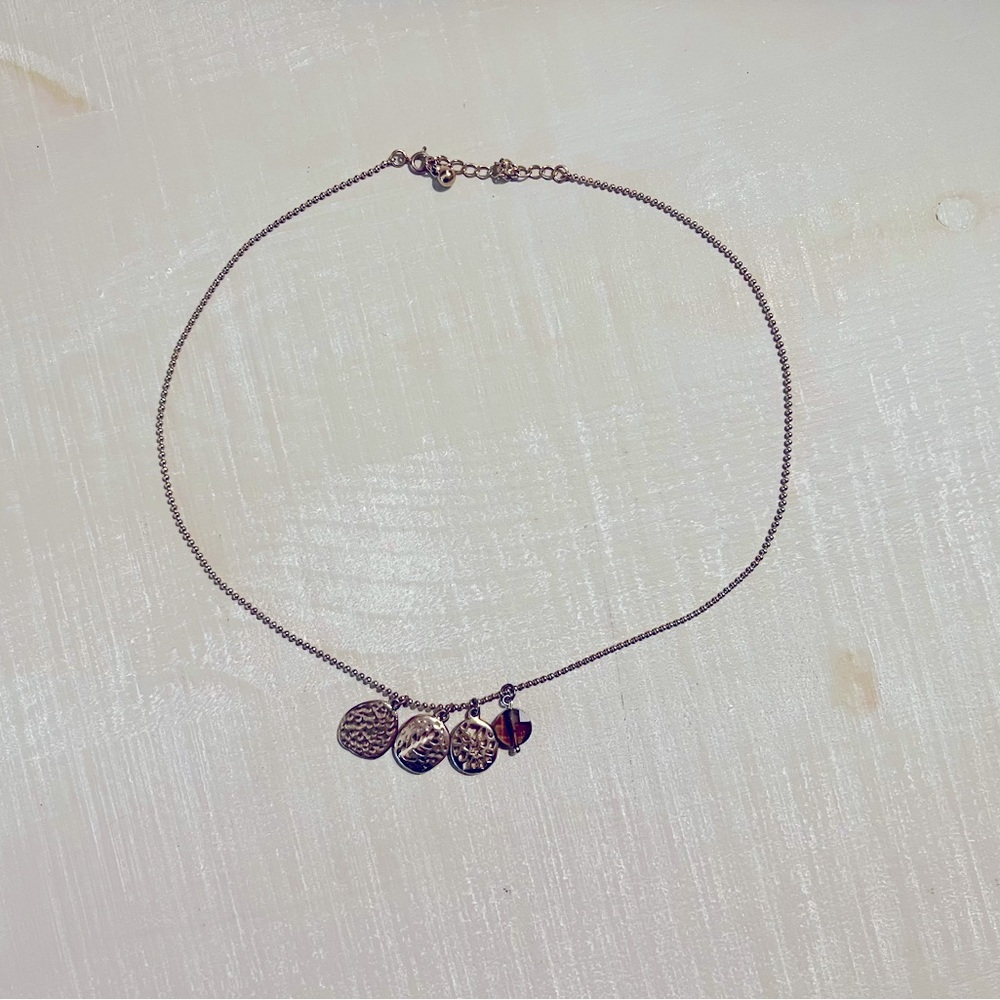 Gold necklace with charms